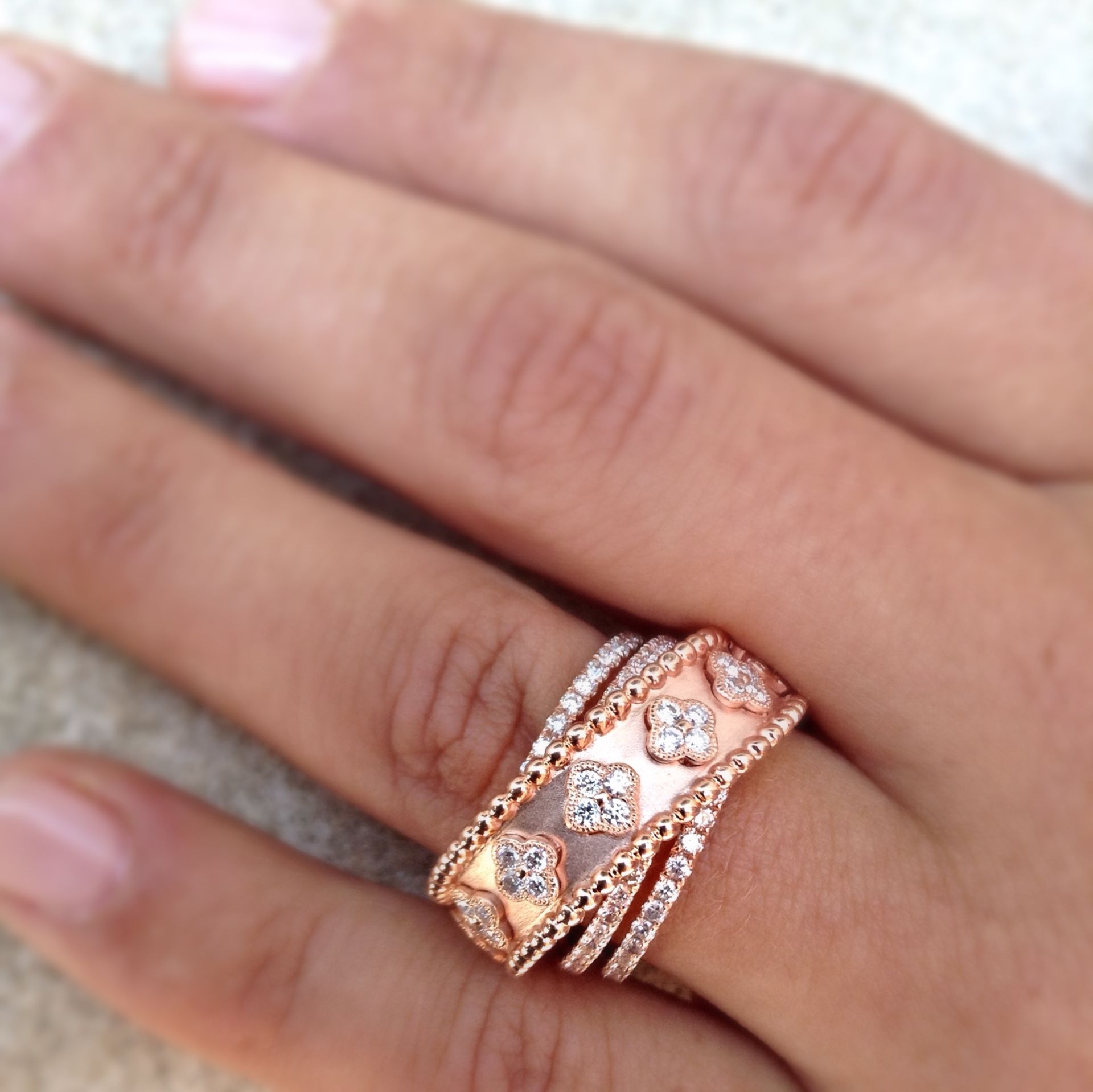 A close up of a woman 's hand with a ring on it