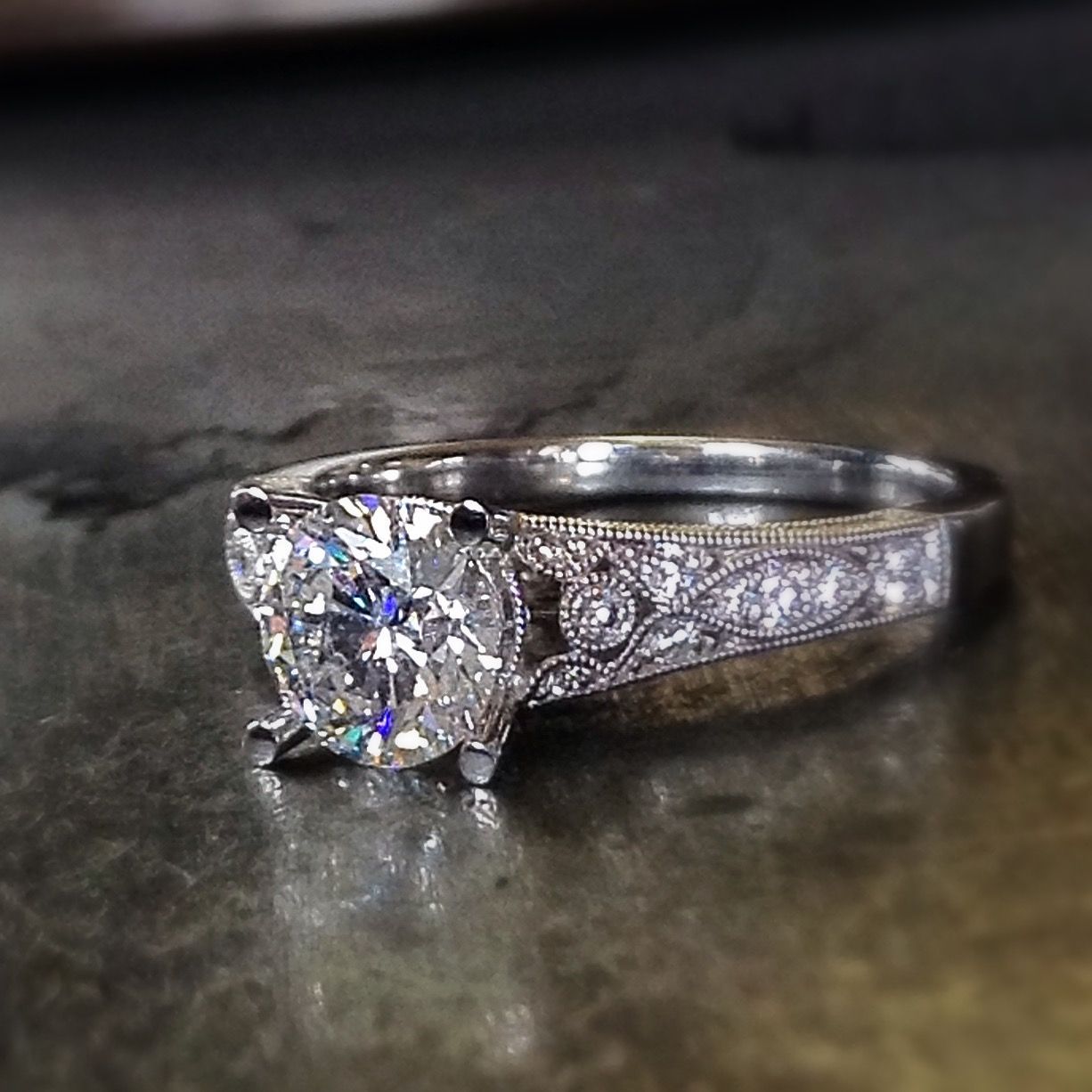 A silver ring with a diamond in the center