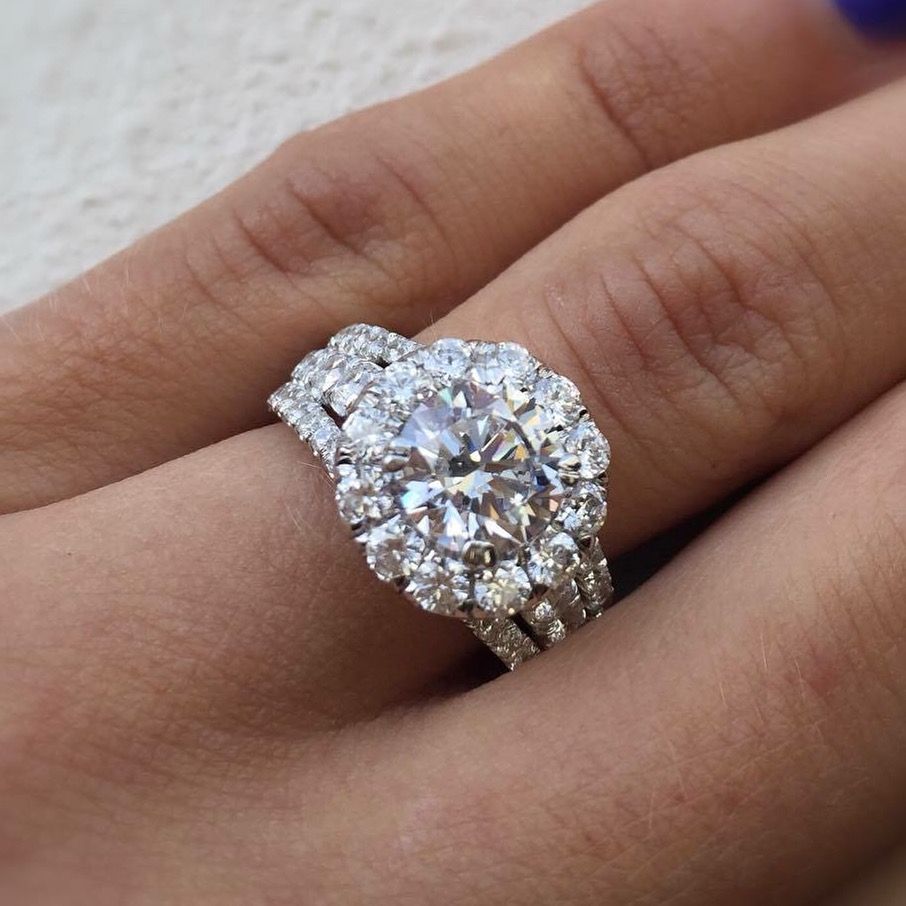 A woman wearing a diamond ring on her finger