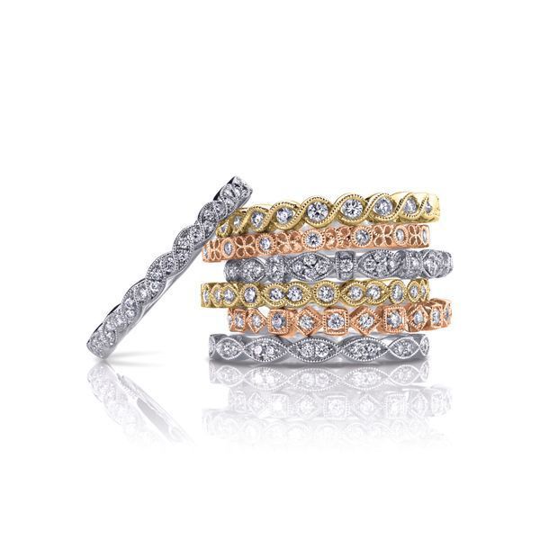 A stack of rings stacked on top of each other on a white surface.