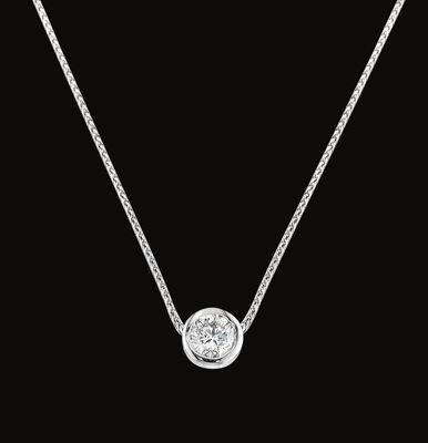 A necklace with a diamond pendant on a chain on a black background.