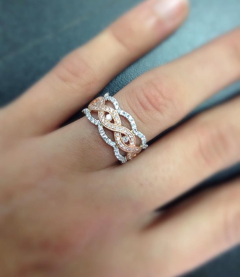 A woman is wearing a ring on her left hand