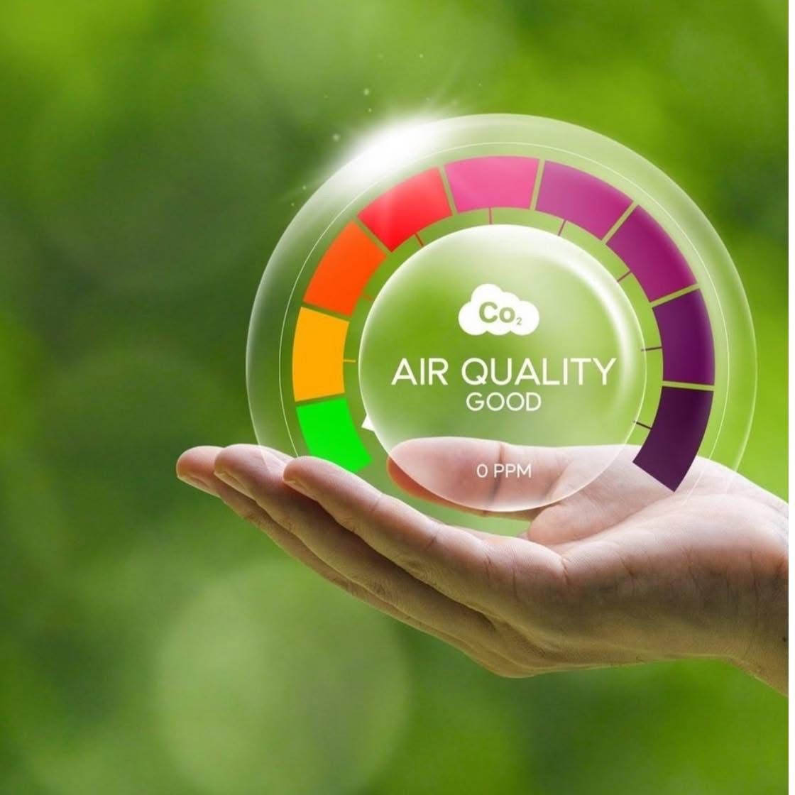 A hand holding a circle that says air quality good