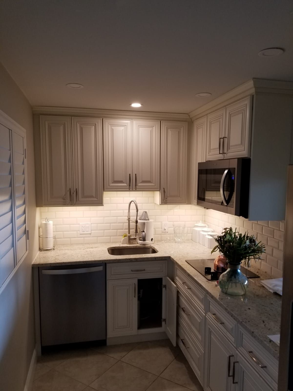 Ambient recessed lighting and custom electrical work in classic kitchen design