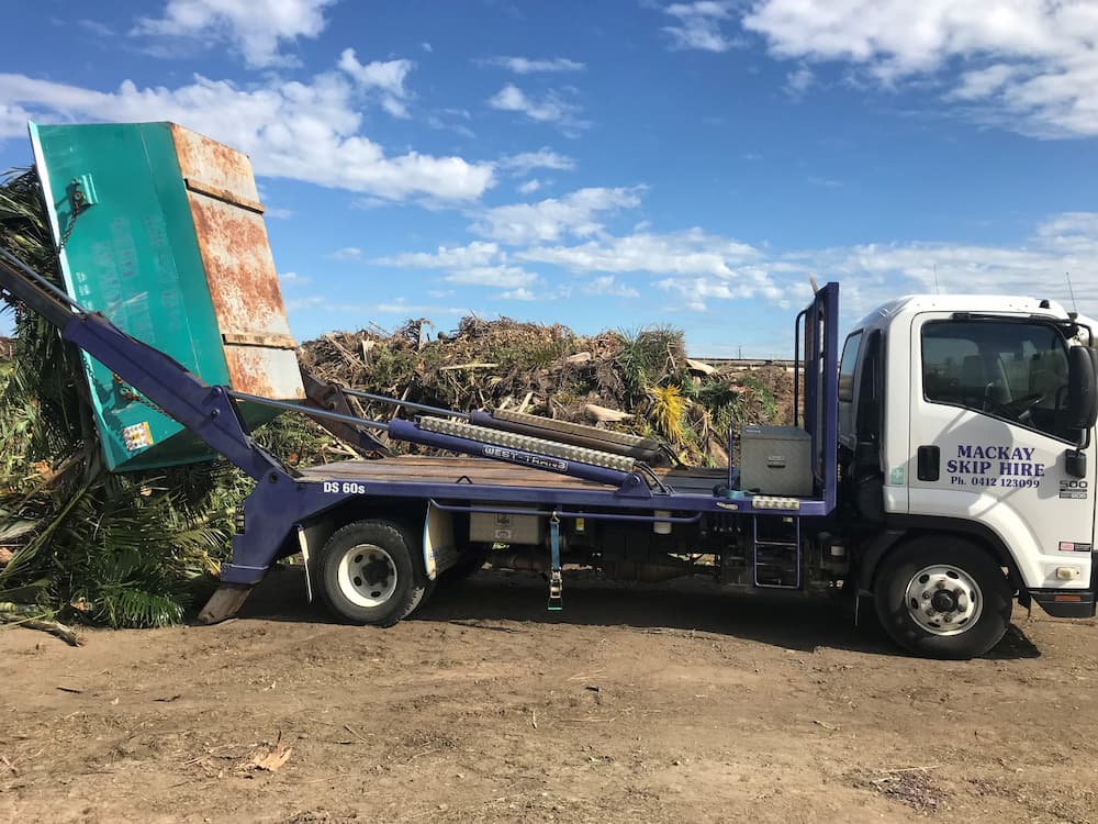 Coconut Palms Being Disposed — Rubbish Removal Services in Andergrove, QLD