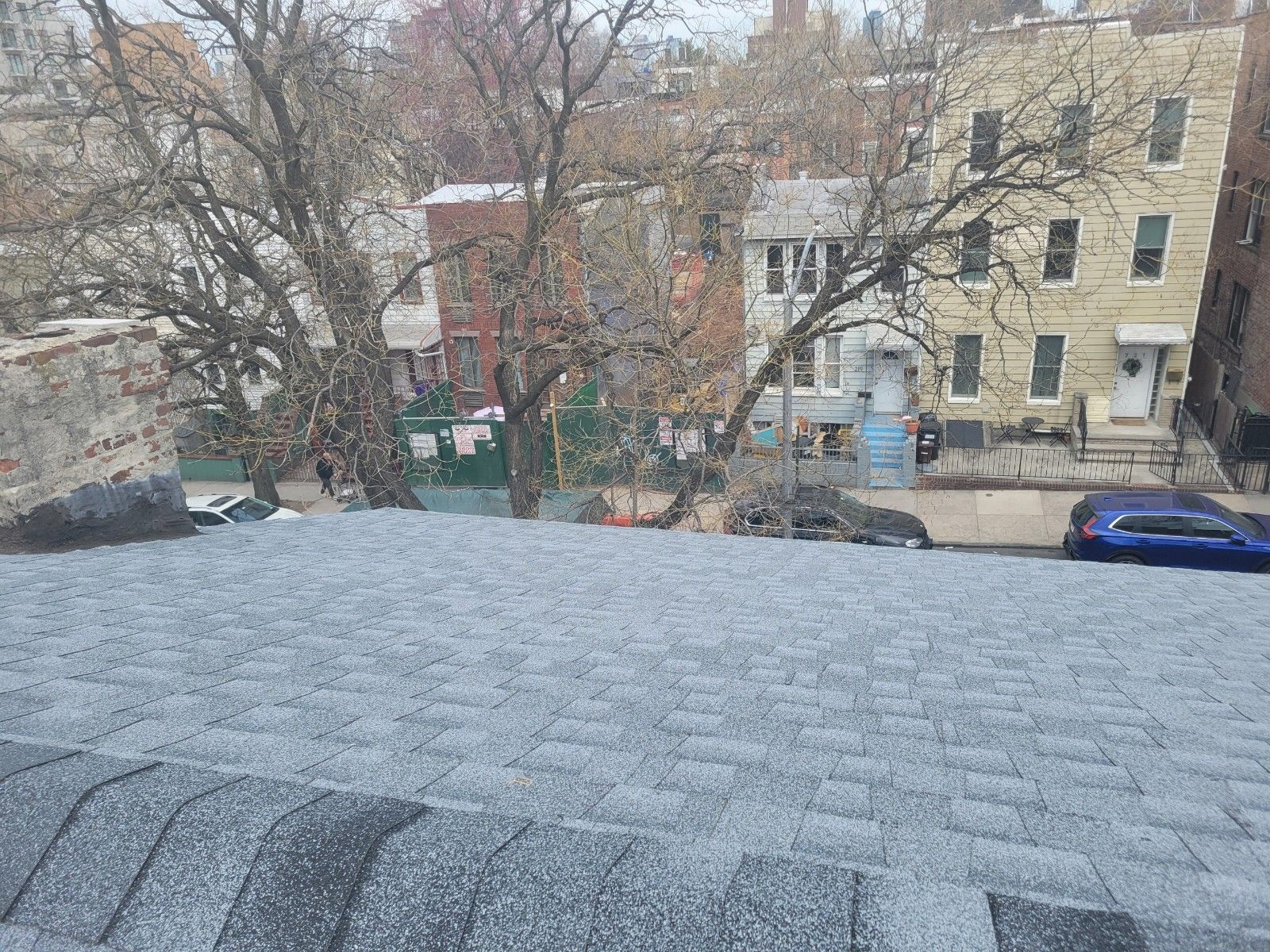 A view of a city from the roof of a building.
