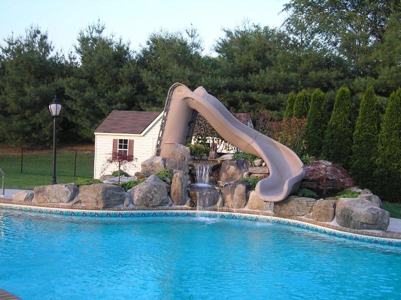 Slide and Rock Waterfall Installation After - Gunnite Pools — Coastal Pools and Spas Inc in Linwood, NJ