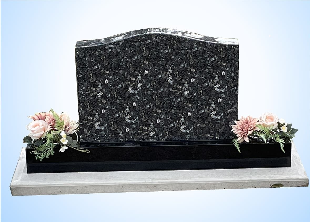 Single Monument Headstone With Flowers — S.R. Horder Monumental Masons in Rutherford, NSW