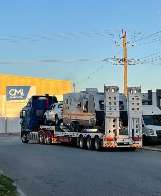truck carrying a lot of car