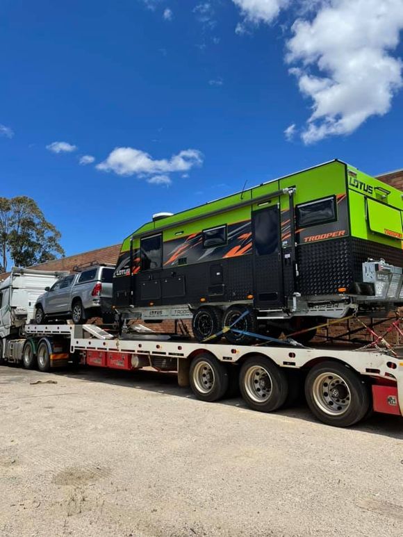 car and a trailer being transported