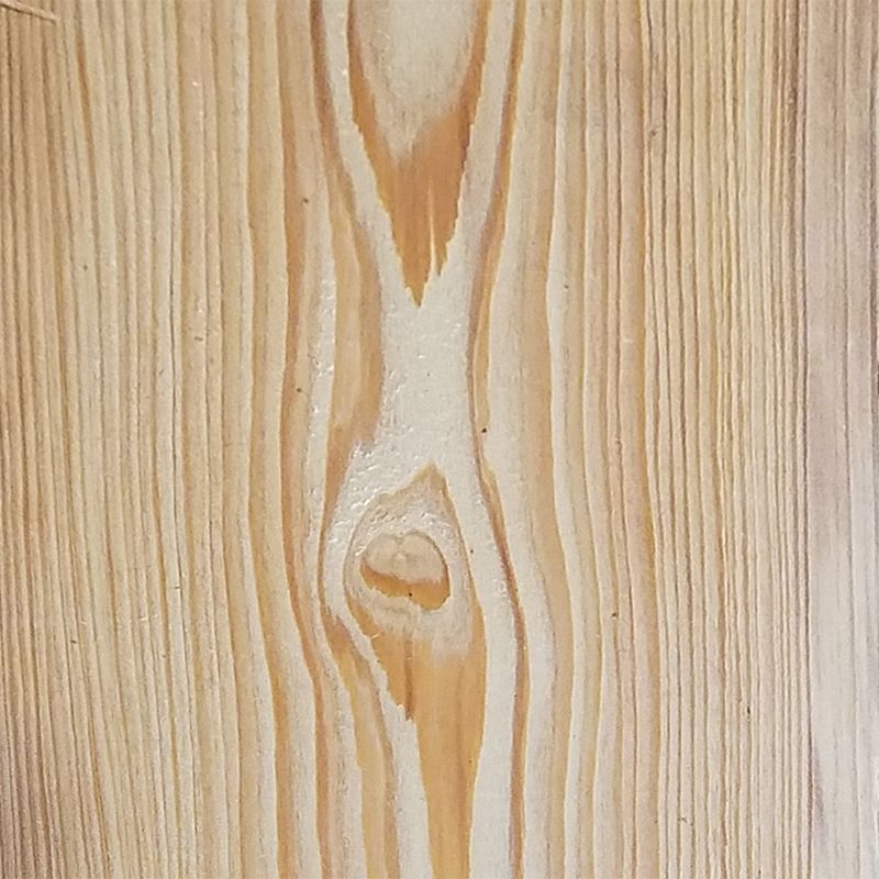 A close up of a piece of wood with a knot in it.
