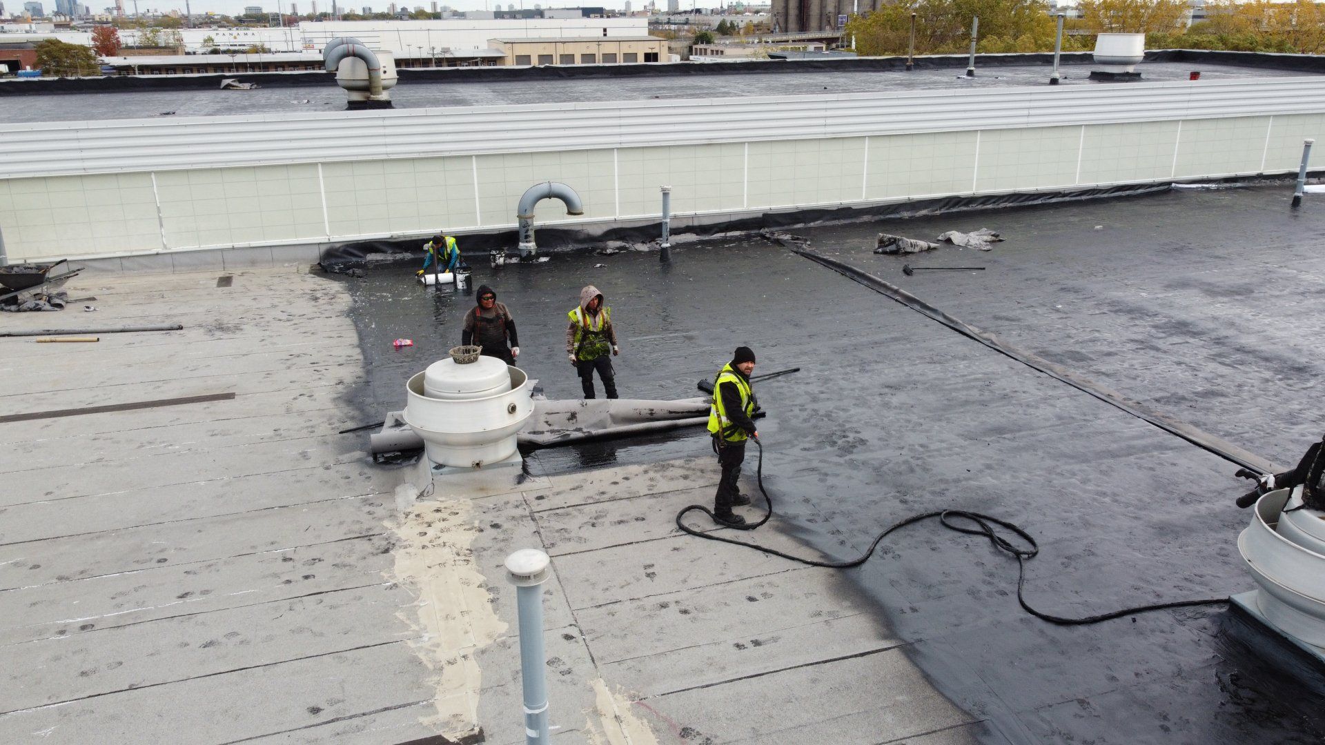workers adding flex star system to roof
