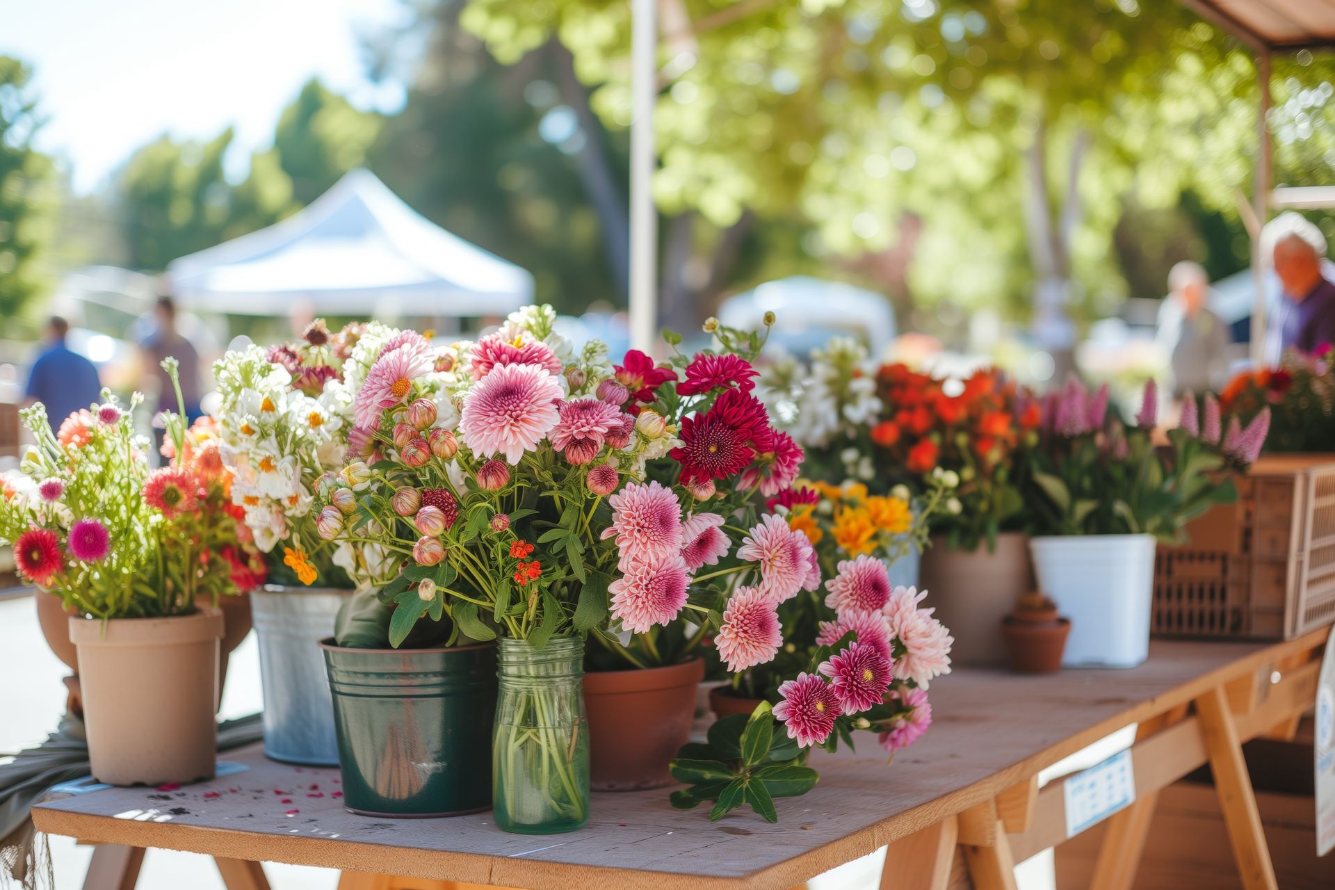 Buckets of fresh cut flowers on a table at the local farmers 'market in Crittenden, KY