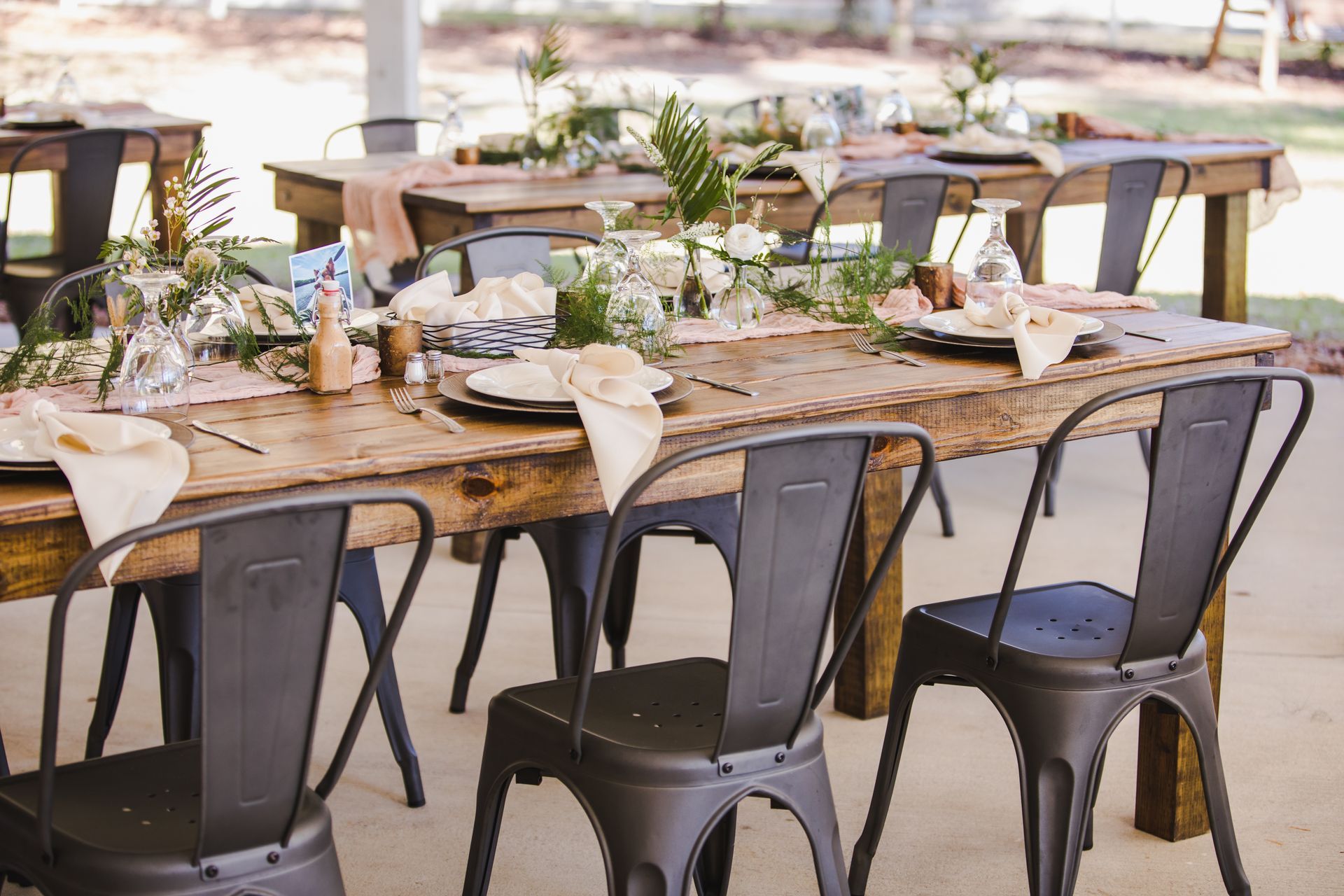 Simple Rustic Wooden Farm Tables Decorated for Wedding Reception