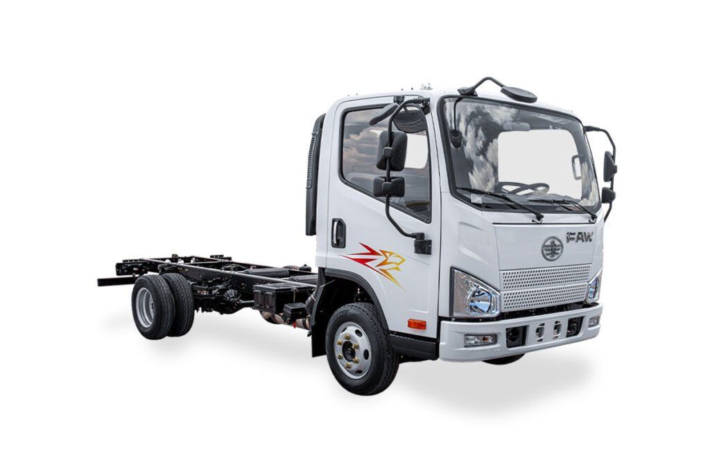 Un camión blanco está estacionado encima de una superficie blanca.