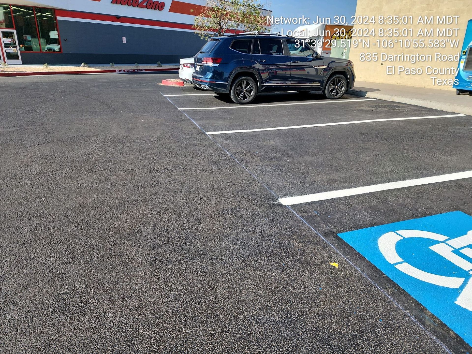 A car is parked in a handicapped parking spot