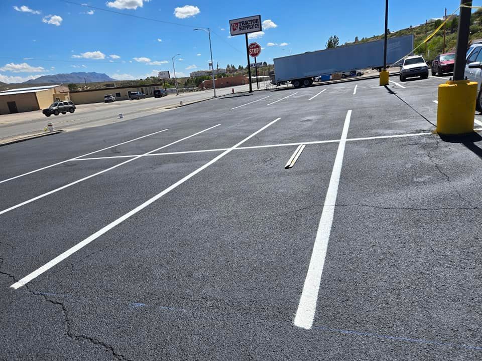 A parking lot with a stop sign in the background