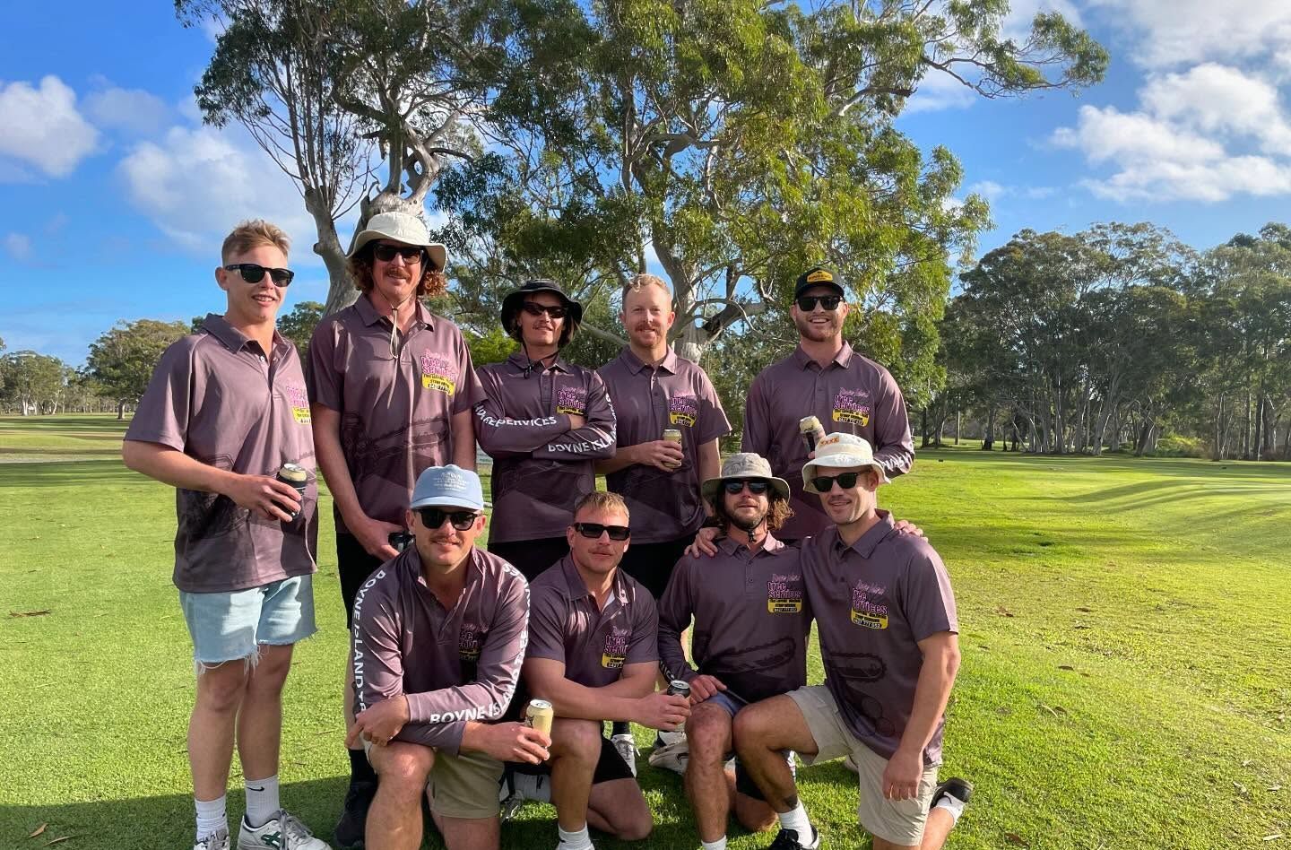 A Man Is Using a Chainsaw to Cut a Tree Branch — Boyne Island Tree Services in Calliope, QLD