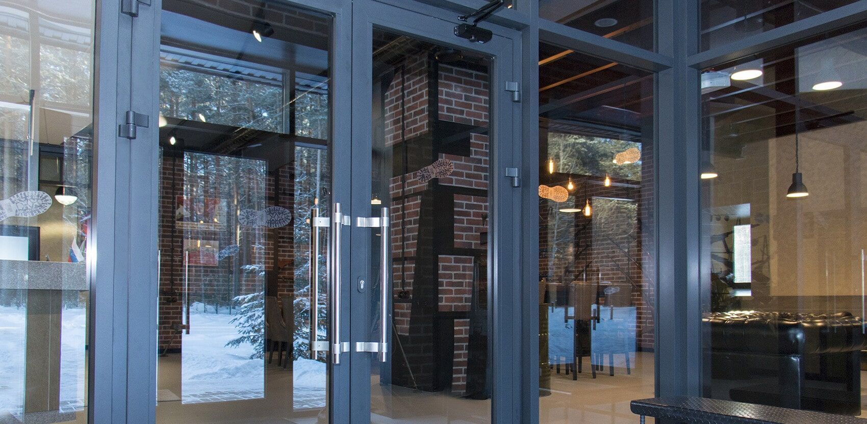 A Large Glass Door in a Building With a Lot of Windows — Darwin Glass in Yarrawonga, NT