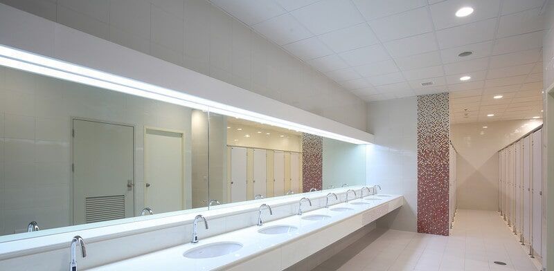 A Public Restroom With a Long Row of Sinks and Mirrors — Darwin Glass in Yarrawonga, NT