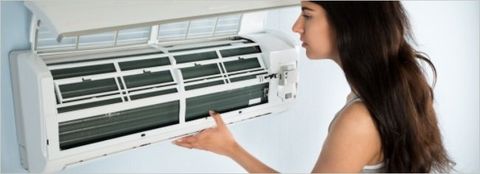Girl Checking Air Conditioner - Heating & Air Conditioning Service & Repair in Martinsville, VA, Comfort Heating & Cooling
