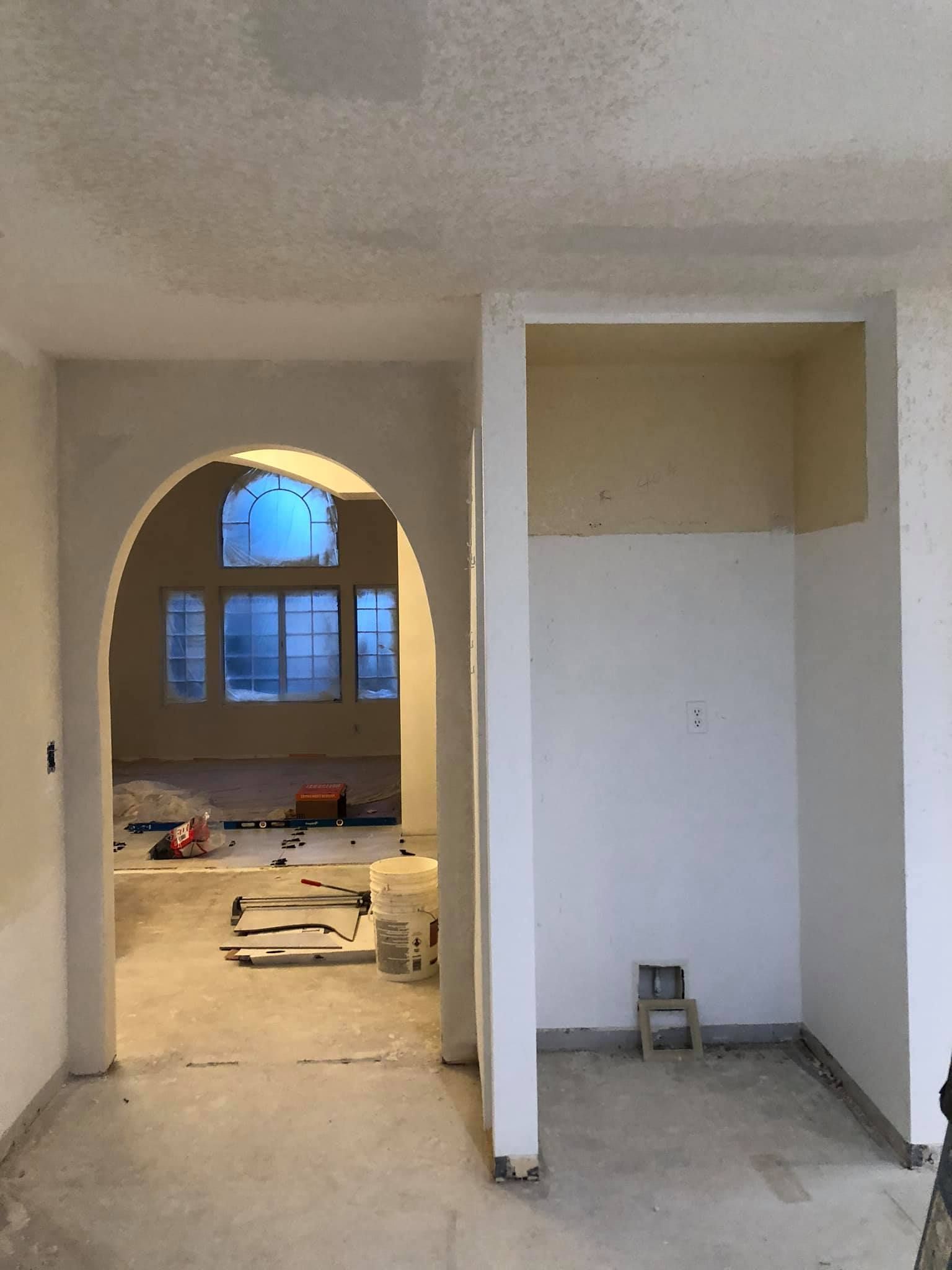 A room that is being remodeled with white walls