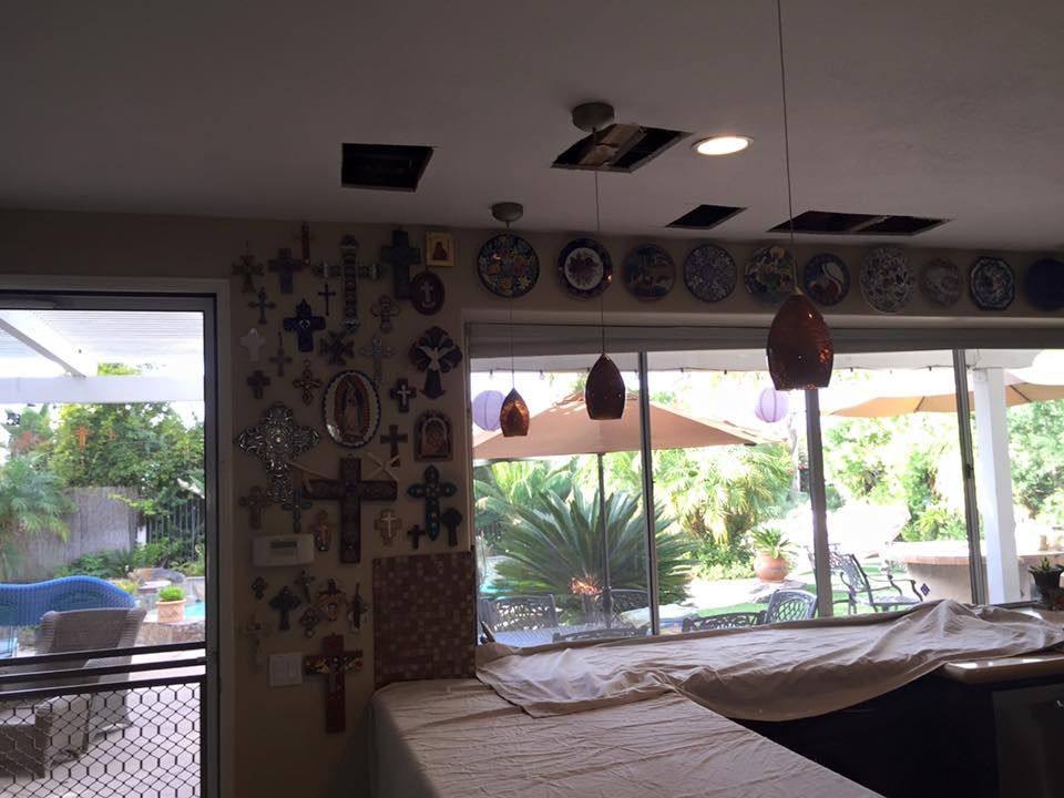 A room with a lot of crosses on the wall