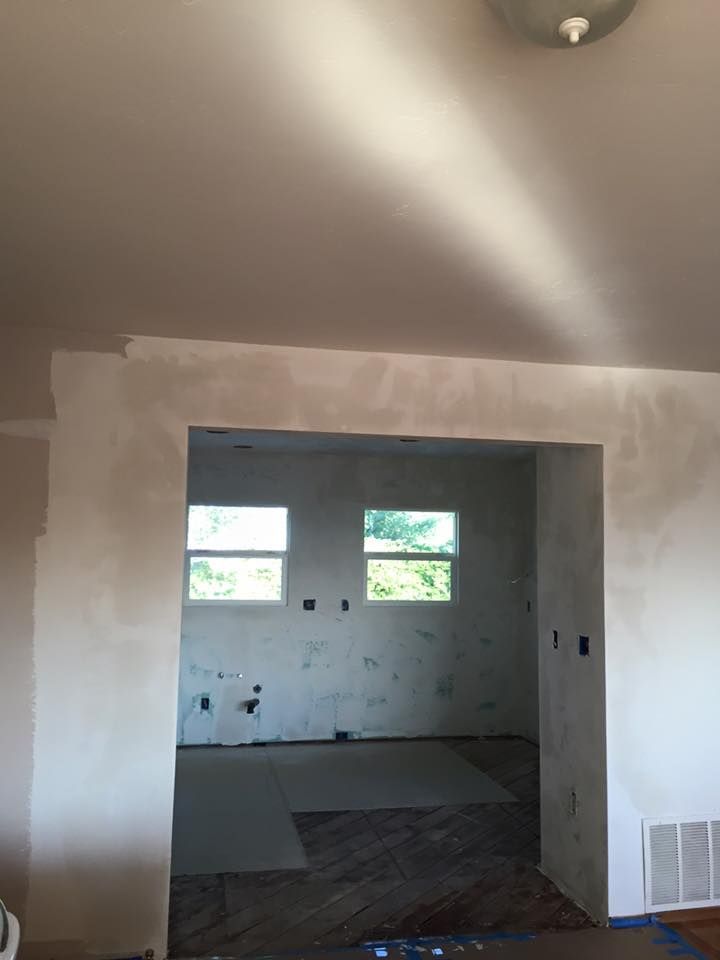 A room with white walls and a ceiling light