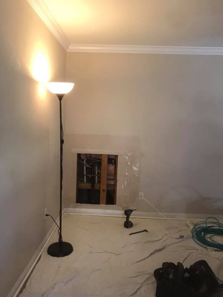 There is a lamp in the corner of the room.