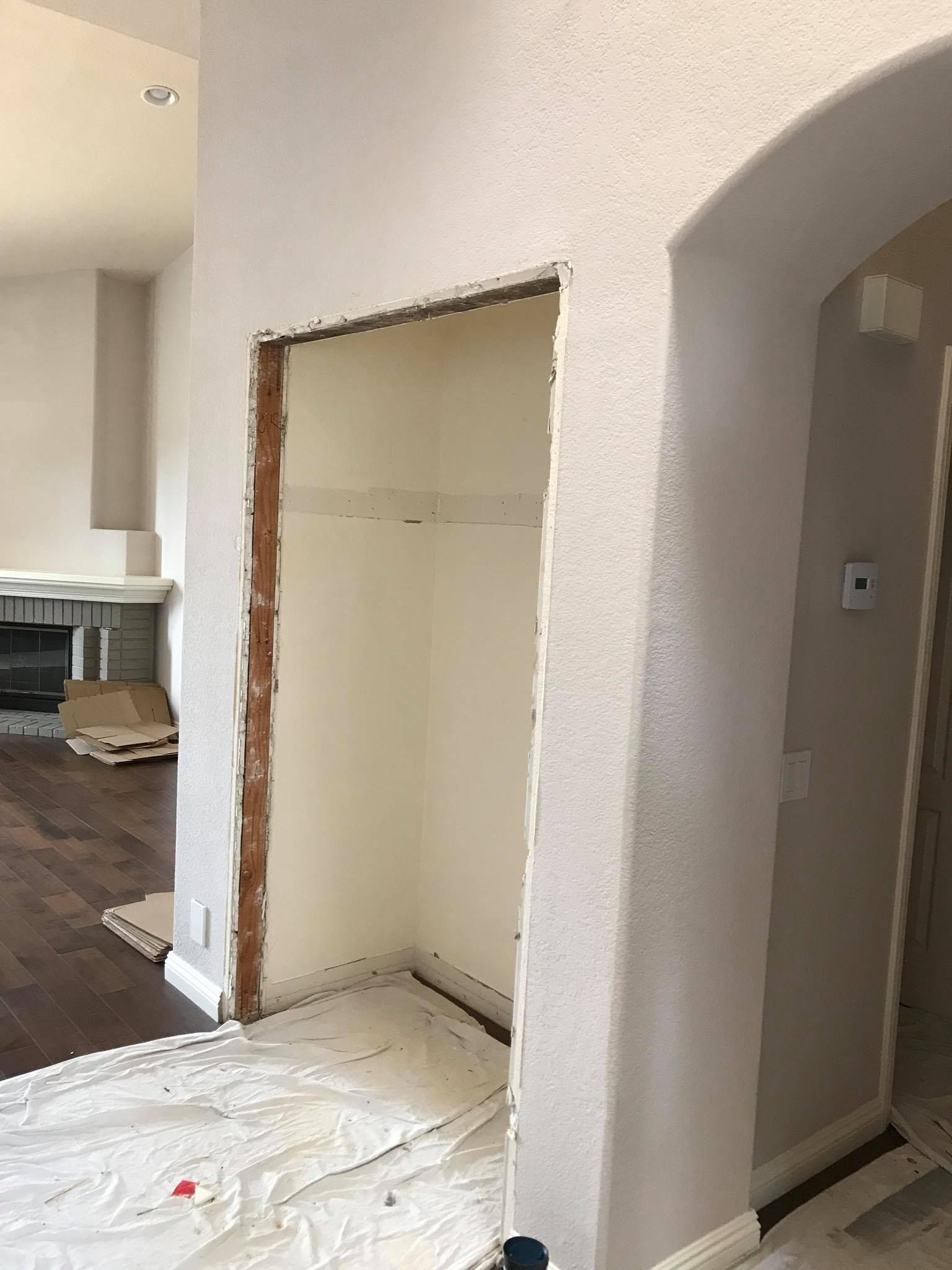 There is a hole in the wall in the middle of the room.