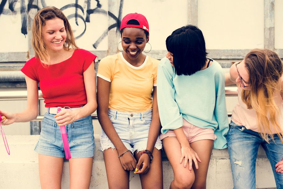 Two young black females socializing This is an image of Two young black females