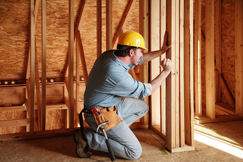 a man in a helmet holding a baseball bat