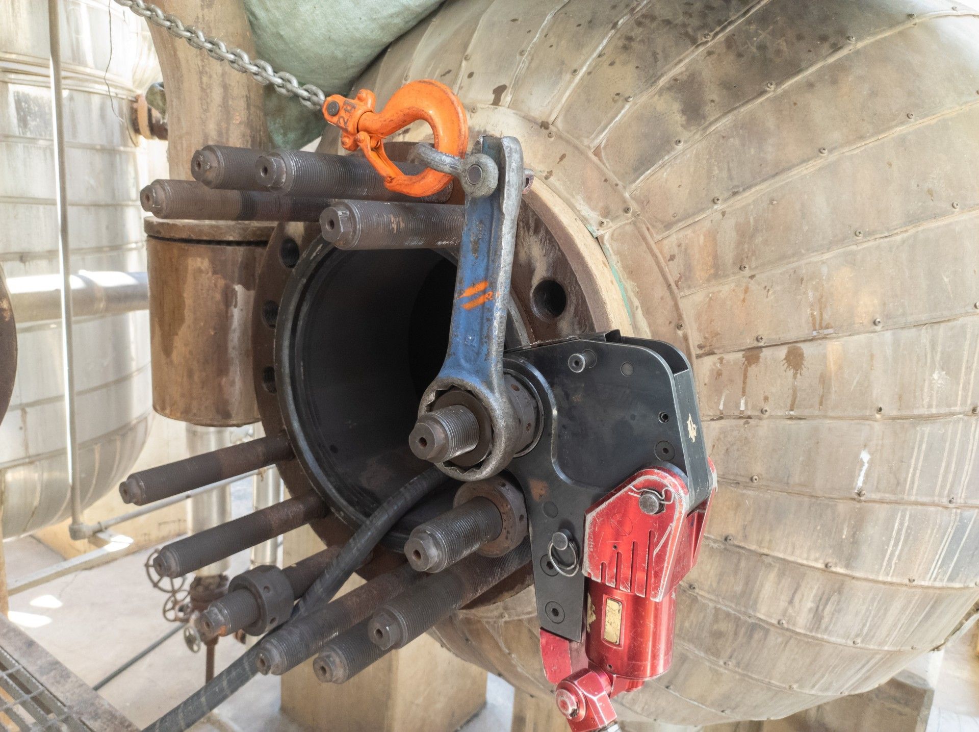 A close up of a machine with a wrench attached to it.