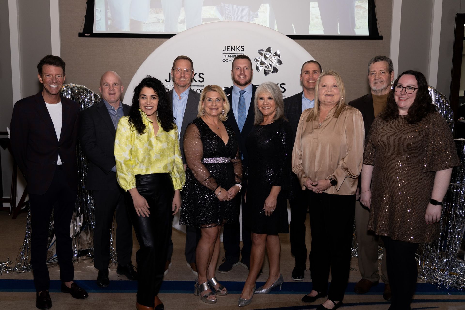 A group of people standing next to each other holding plaques.