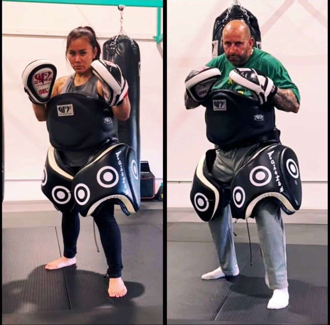 Two people in boxing gear, posed in a gym setting, one female, one male. They wear chest and thigh pads, ready to practice.
