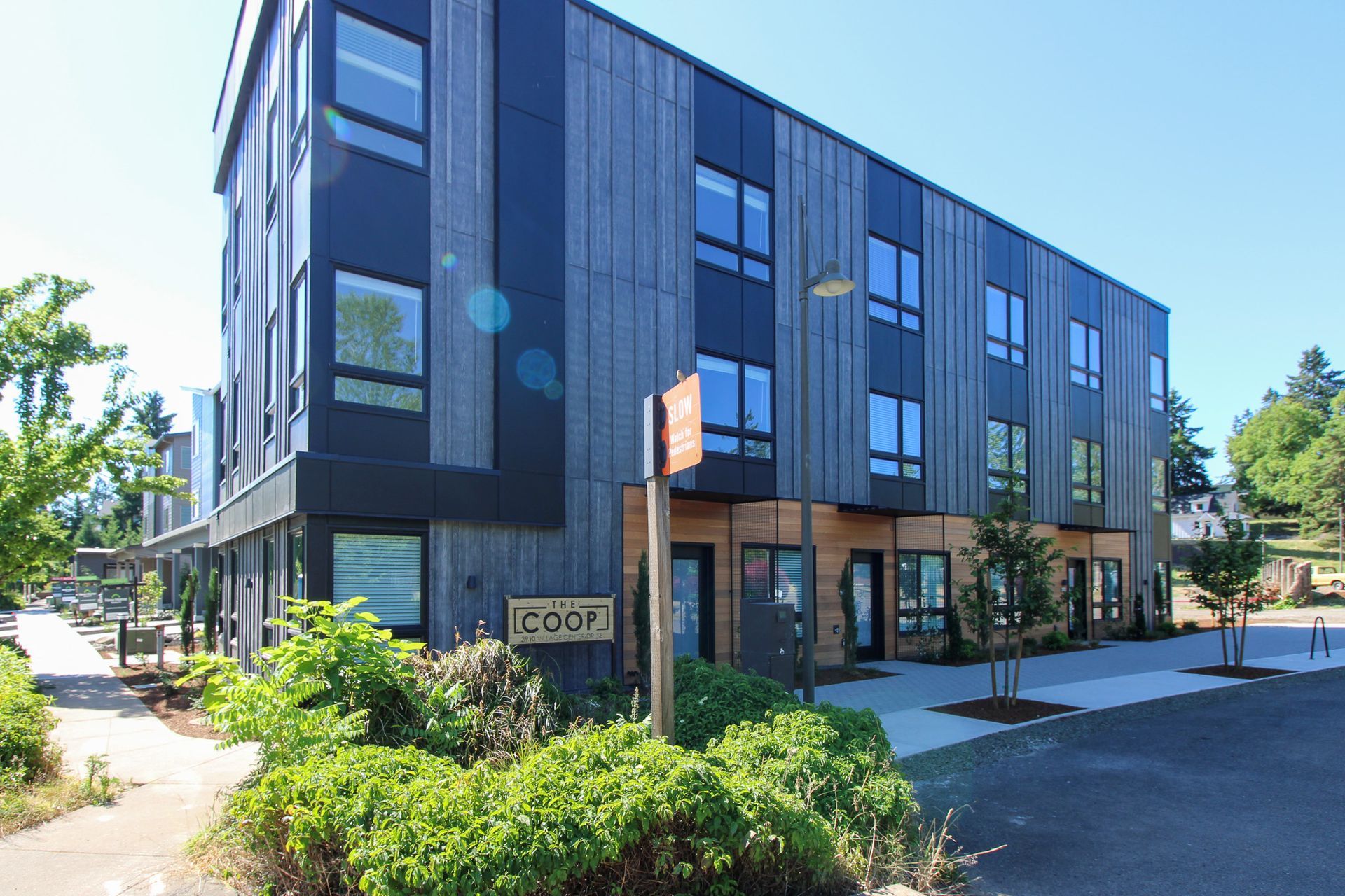 A large building with a sign that says coop on it