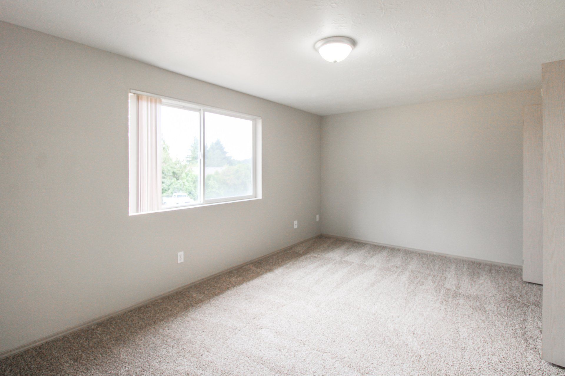 There is a large window in the middle of the room.