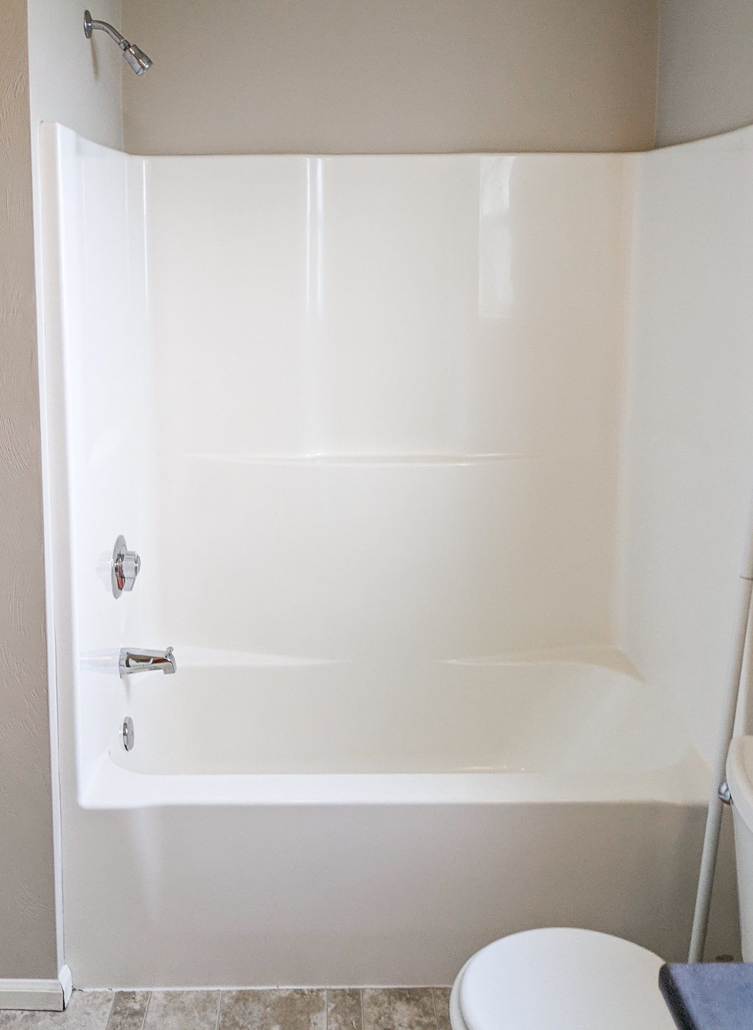 A bathroom with a bathtub and a toilet.