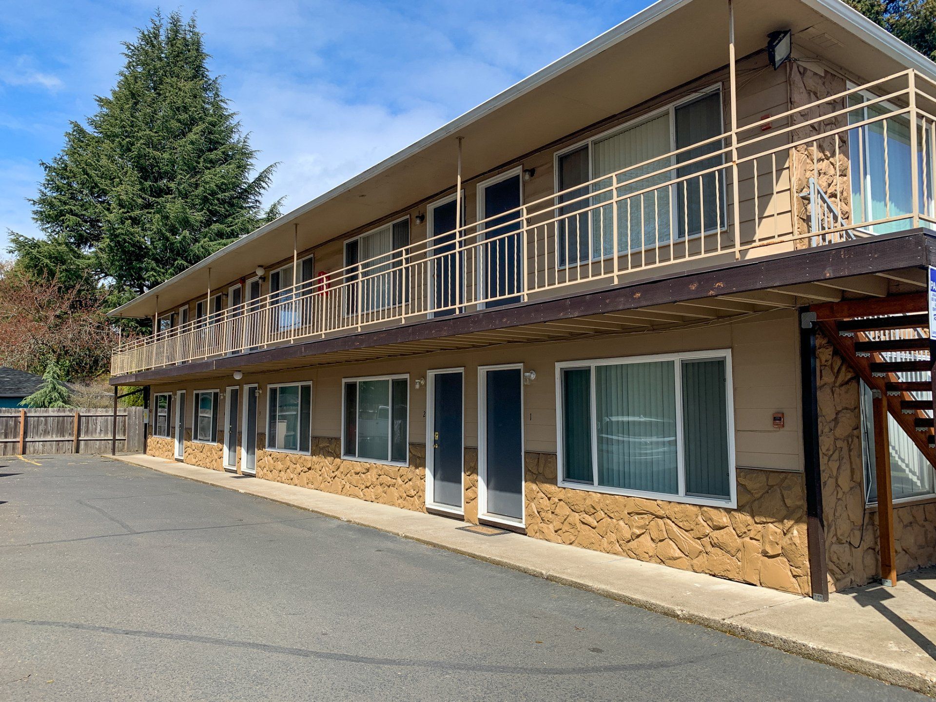 A large apartment building with a lot of windows and balconies.