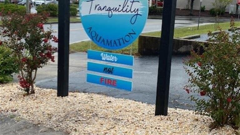 A sign that says tranquility aquamation on it