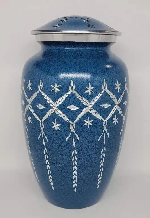 A blue vase with a silver lid and white flowers on it