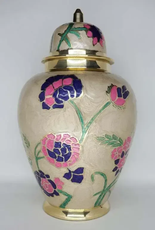 A white vase with pink and blue flowers on it