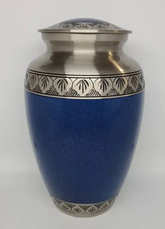 A blue vase with a silver rim and leaves on it.