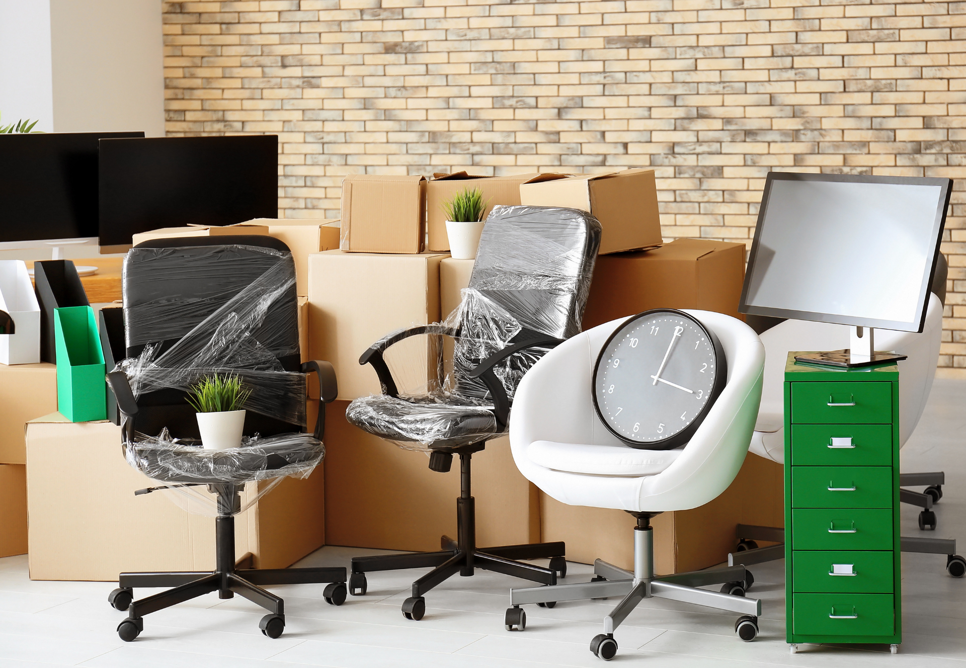 A man is using a high pressure washer to clean a sidewalk.