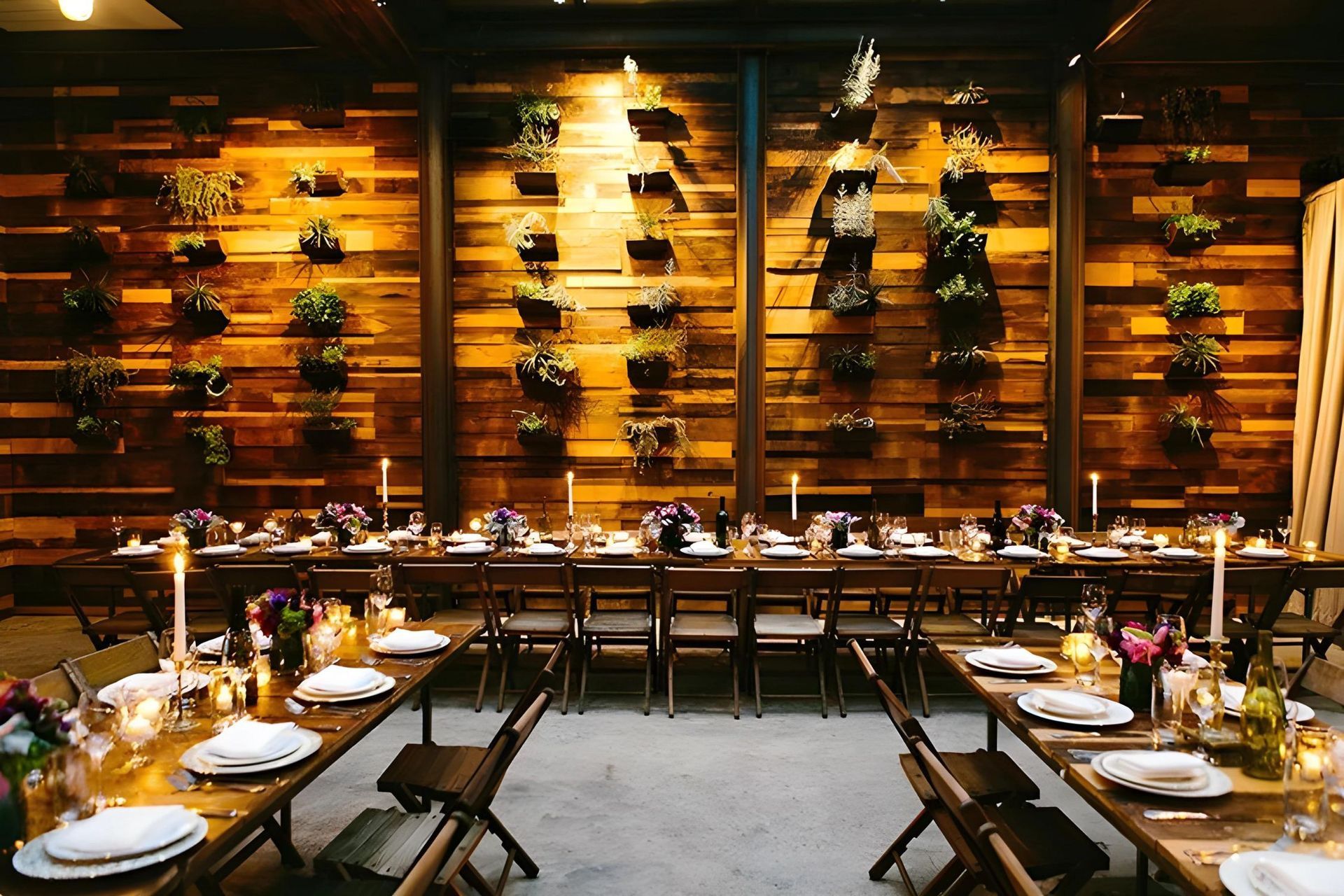 A dining room with tables and chairs and a wooden wall