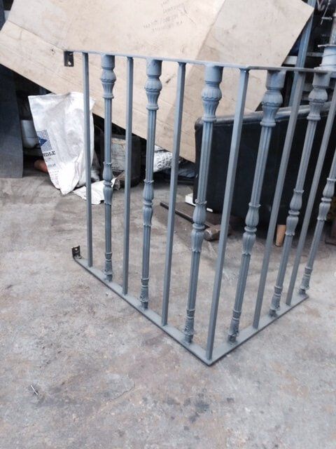 Metal fencing being constructed