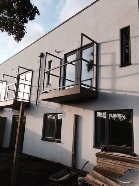 Small single balconies on a building