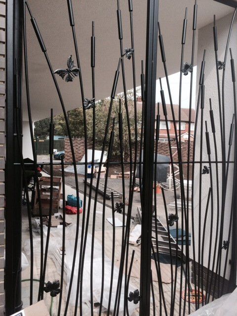 Metal reed and butterfly railings