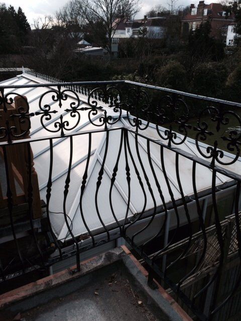 Curved metal fencing around a balcony