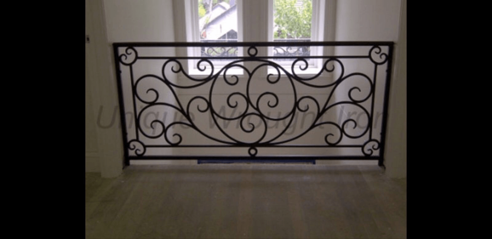 Black metal fencing inside a building